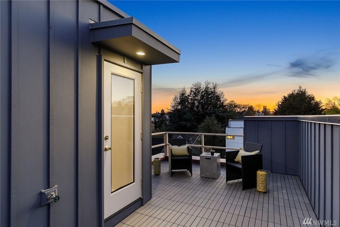 Panel siding and trim at a rooftop door