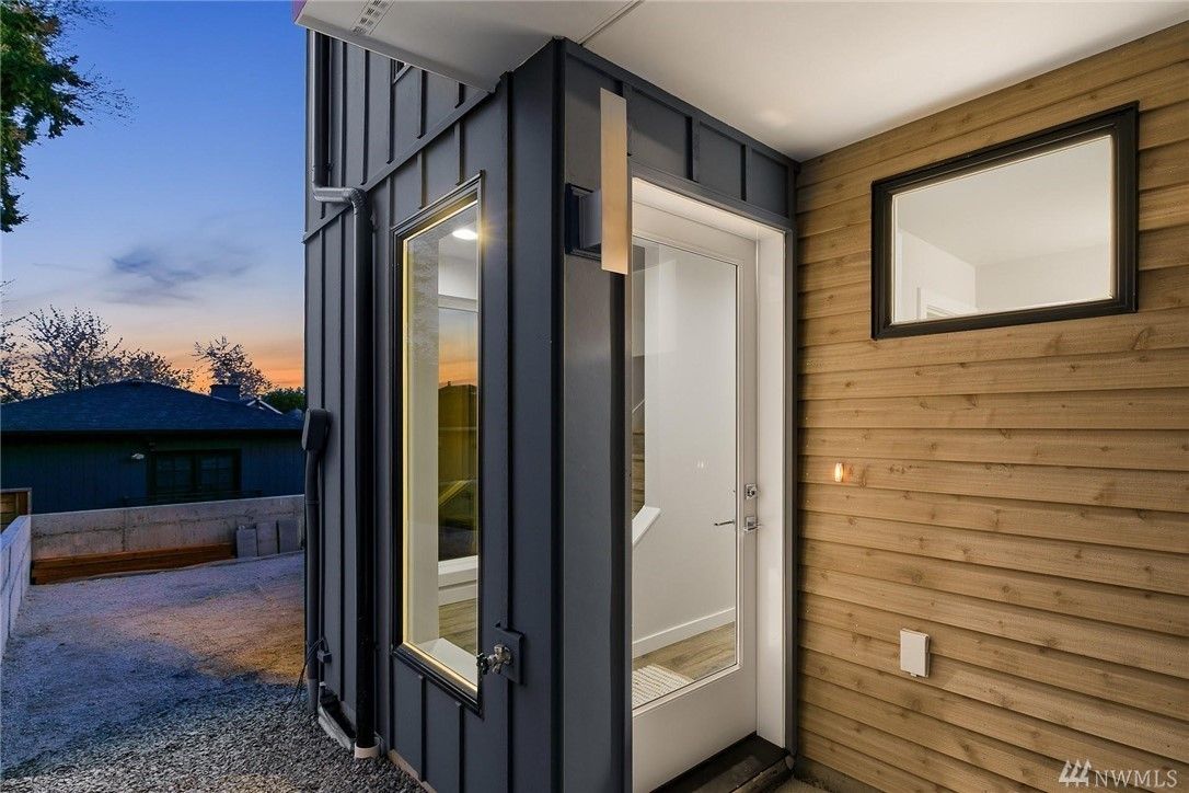 Panel siding and trim at a rooftop door