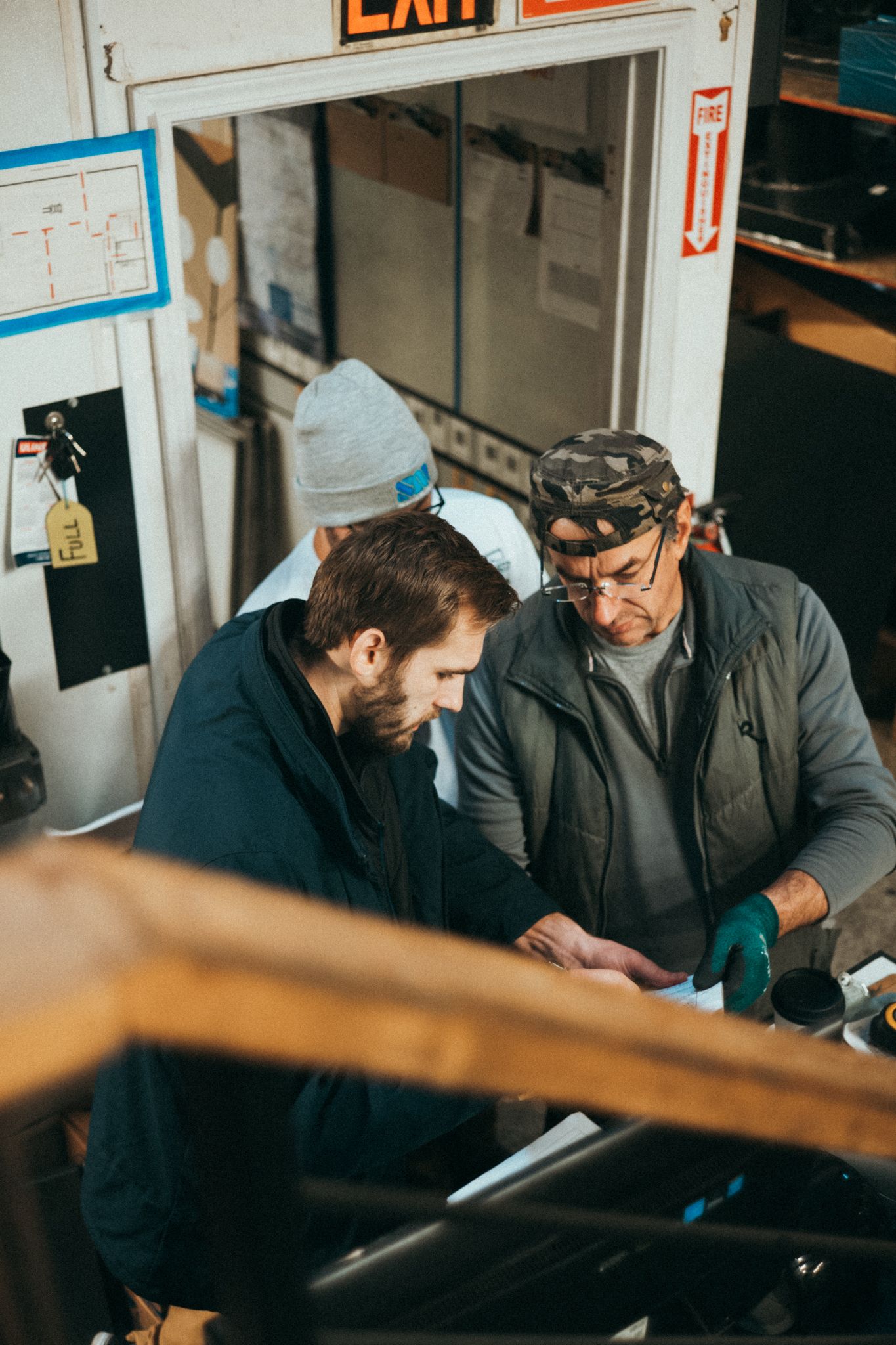 Two Seattle Metals team members review a drawing