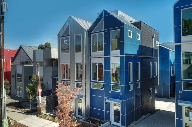 Blue metal panel siding on townhouses