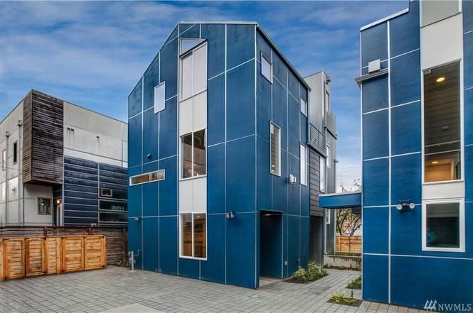 Blue panel siding on a row of townhouses